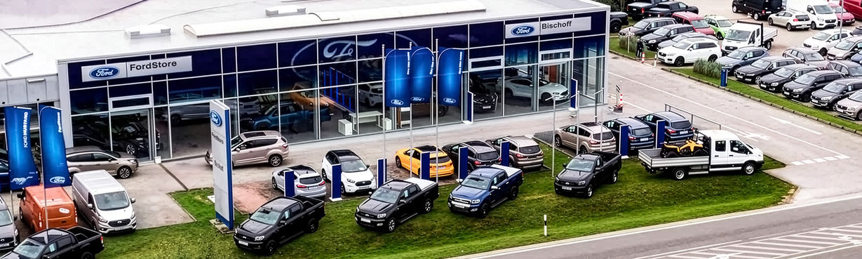 Autohaus Bischoff car dealership exterior with showroom and vehicles